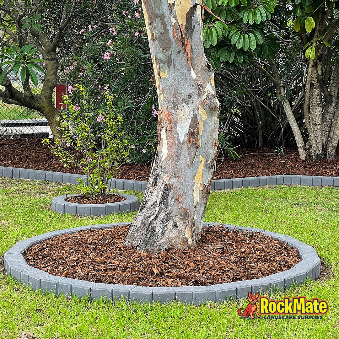 Wedgeblok tree ring and curved garden bed edge in Charcoal