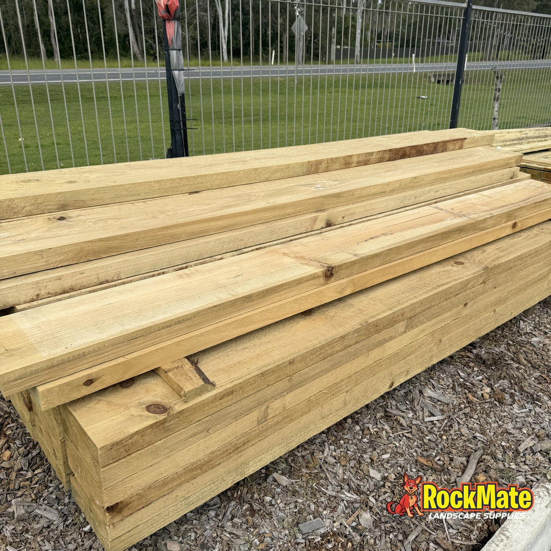 CCA treated hardwood posts stacked at the RockMate North Maclean yard