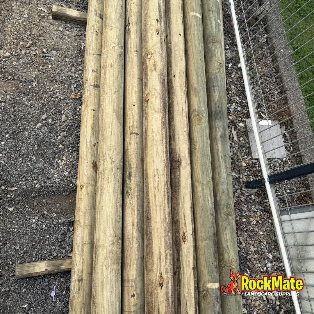 100mm treated pine round logs at the RockMate North Maclean yard