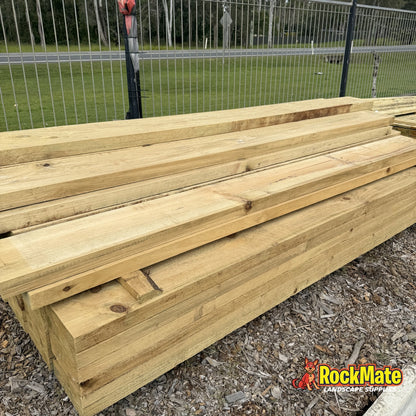 Cut ends of 75 x 38mm treated pine fence rails showing the section size