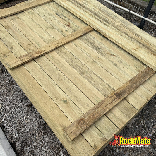 Treated pine flat top palings 100 x 16mm laid out at the RockMate yard