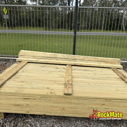 Stack of 1.8m treated pine flat top fence palings