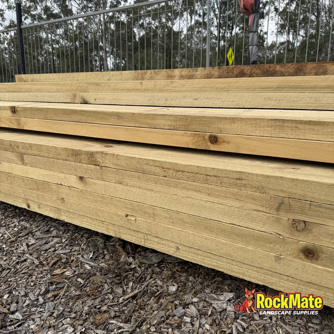 Stack of 3.0m treated pine retaining wall sleepers