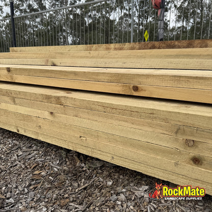 Stack of 3.0m treated pine retaining wall sleepers